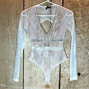 Lacey long sleeve body suit deep v neck creamy white Pretty Little Thing size 2